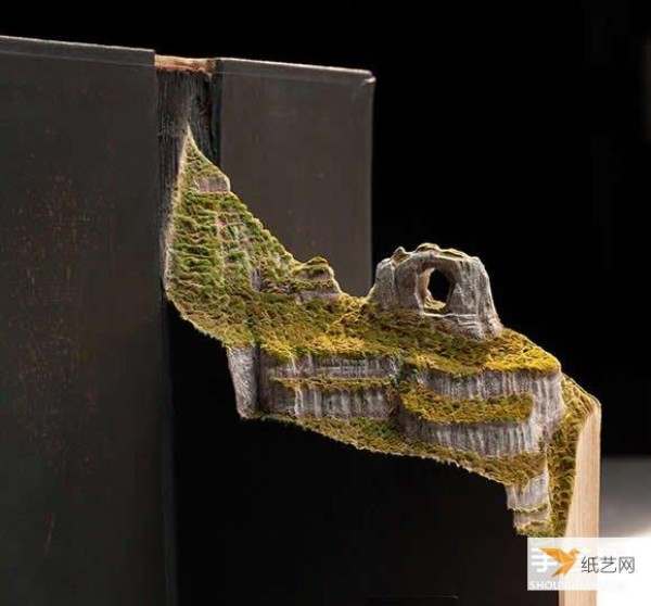 Transform the geography textbook directly into a super realistic book sculpture