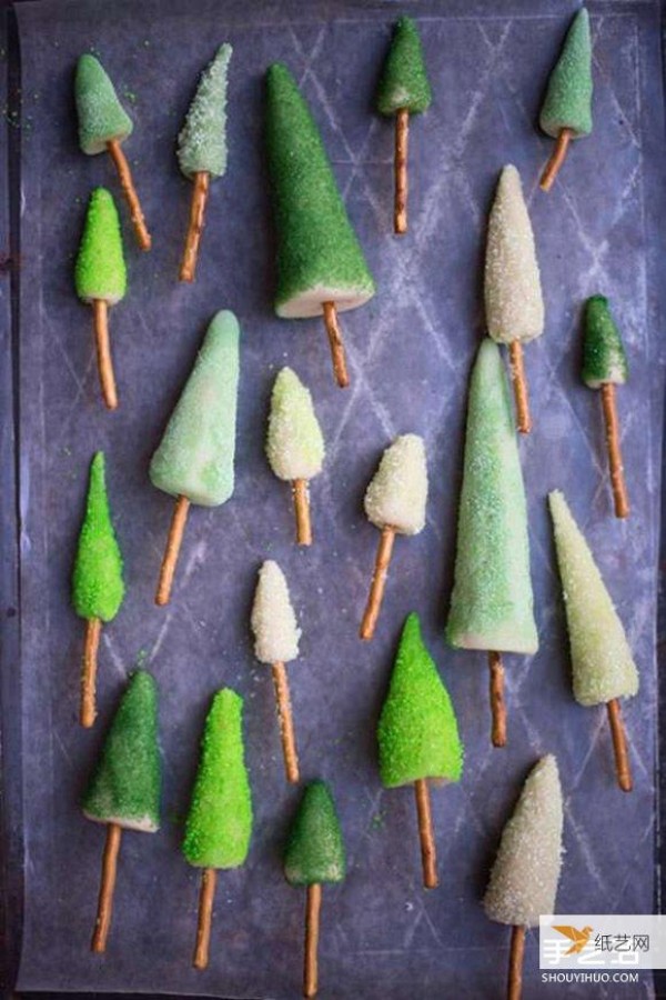 Decorated birthday cake with your own homemade mini candy Christmas tree