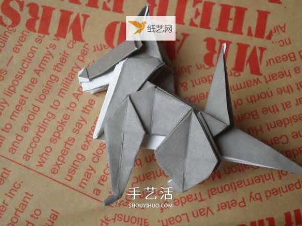 Illustration of hand folding cute puppy using origami