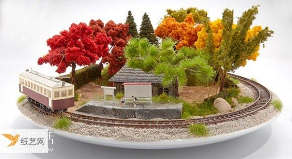 The train successfully drove into Bonsai Bonzai style railway model made by Japans Bonrama