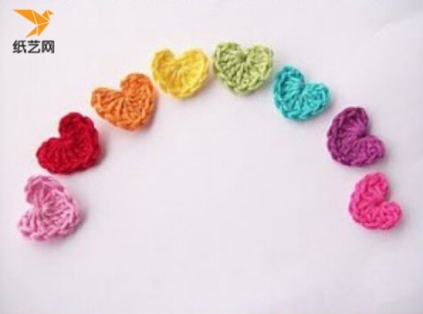 Appreciation of hand-knitted crochet heart-shaped charms