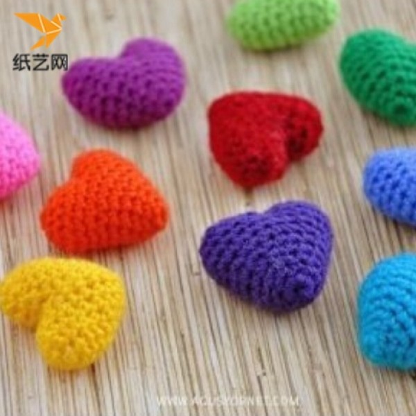 Appreciation of hand-knitted crochet heart-shaped charms