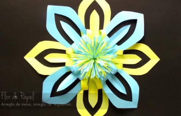 A complete tutorial on how to make New Years snowflakes and cut paper flowers into three-dimensional configurations