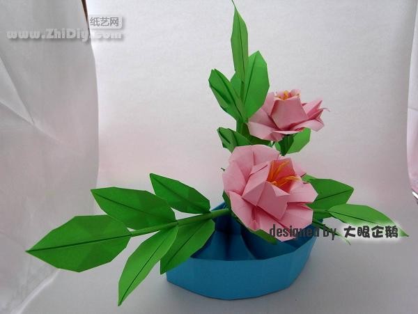 Origami flower bonsai with big-eyed penguin