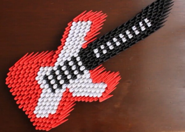 DIY video tutorial on hand-making origami triangle guitar plug