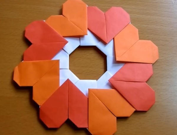 A complete Valentines Day origami gift tutorial that teaches you step by step how to make a Valentines Day origami heart wreath.