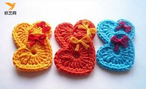 Appreciation of hand-knitted crochet heart-shaped charms