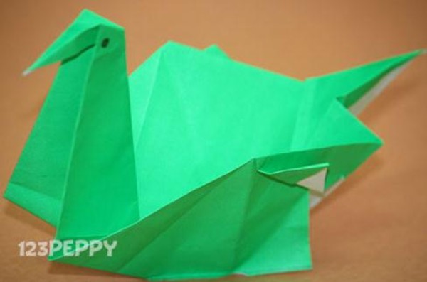 Childrens Origami Encyclopedia teaches you step-by-step video tutorials on how to fold an origami swan.