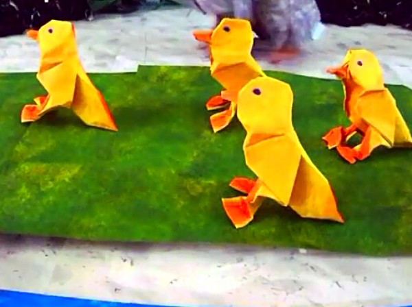 Origami tutorial teaches you how to make a yellow origami duck.