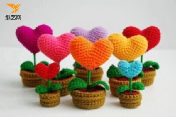 Appreciation of hand-knitted crochet heart-shaped charms