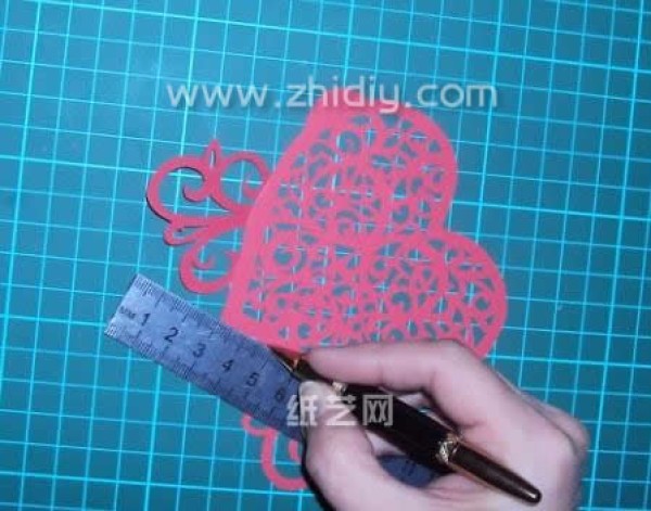 Tutorial on how to make hand-carved paper hearts for Valentine’s Day gifts with actual pictures