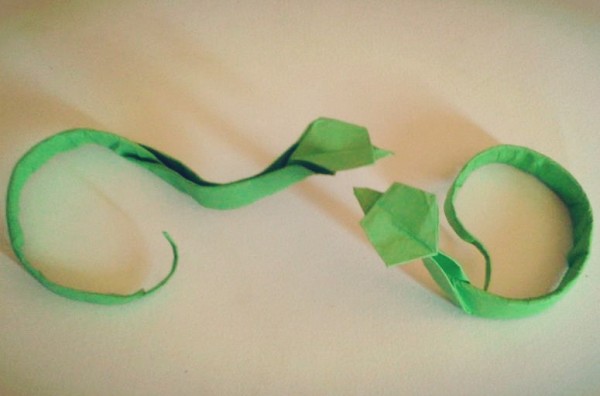 Origami Encyclopedia teaches you how to fold a simple origami snake by hand