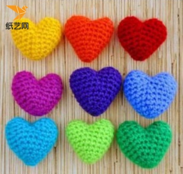 Appreciation of hand-knitted crochet heart-shaped charms