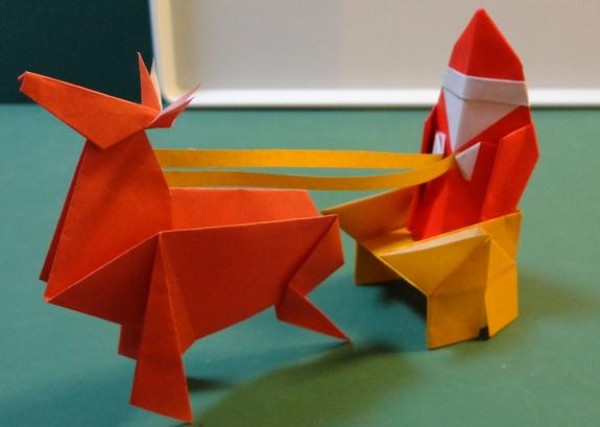 Santas Christmas Origami Tutorial teaches you how to make simple origami Santa Claus