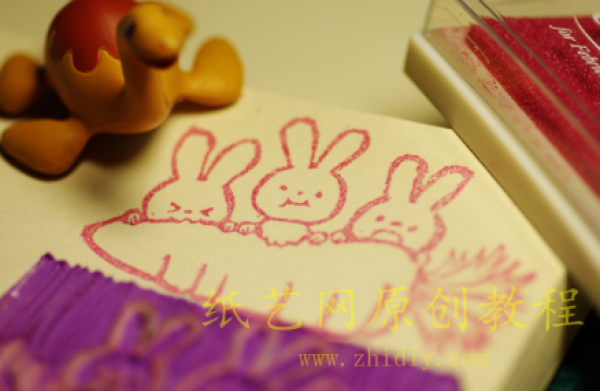 Rubber stamp little rabbits who love to eat carrots