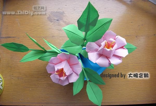 Origami flower bonsai with big-eyed penguin