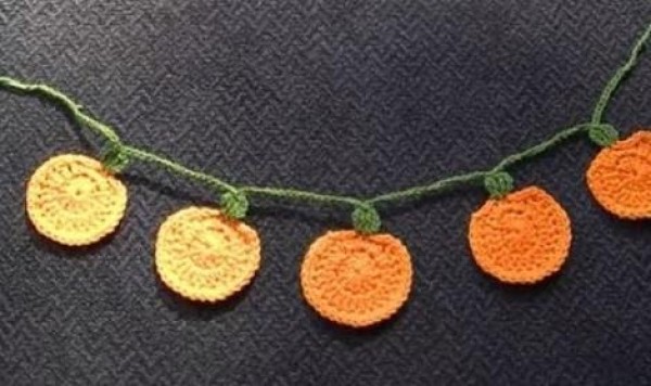 DIY tutorial for making Halloween handmade crocheted pumpkin lantern pendants