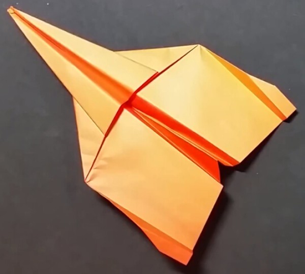 Paper airplane folding tutorial for gliding origami fighter