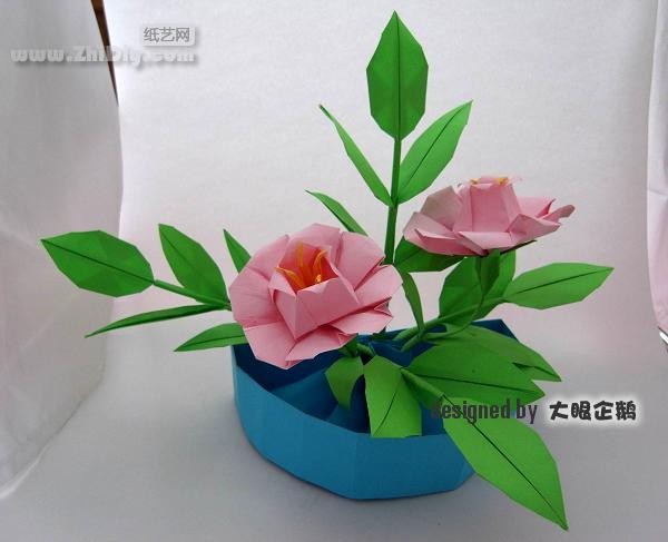 Origami flower bonsai with big-eyed penguin