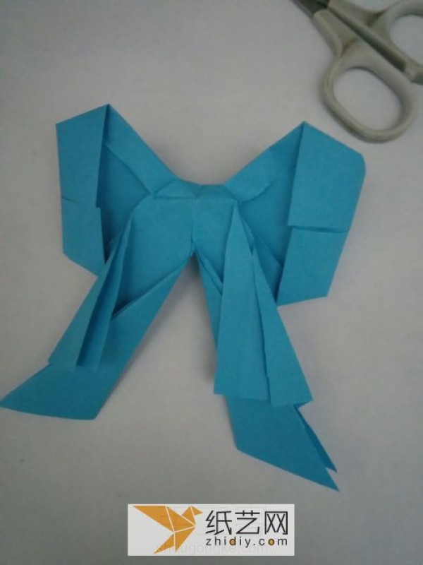 Perfectly shaped origami bow, a must-have decoration on various greeting cards