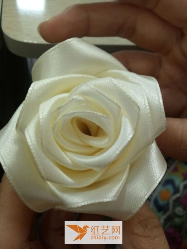 Ribbon making fabric roses for christmas gifts