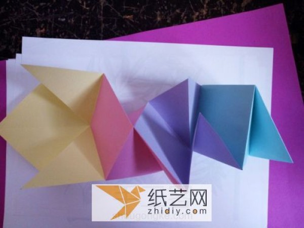 A complete tutorial on exploding box mechanisms to teach you how to make a mysterious origami book