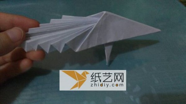 An origami peacock with its tail open