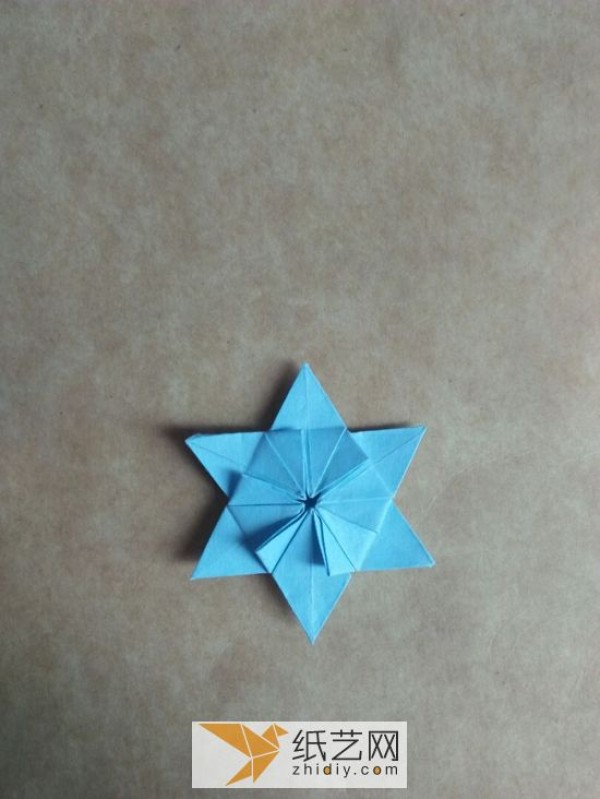 You can also fold a piece of paper into three-dimensional snowflakes!