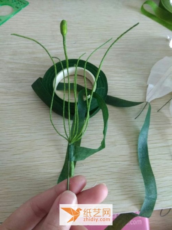 Paper art lilies made of crepe paper New Year decoration tutorial illustration