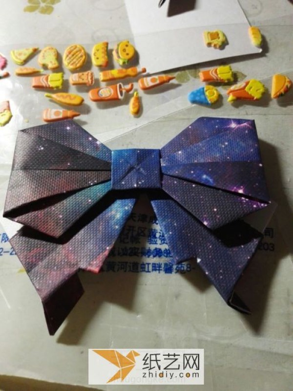 Beautiful origami bow to decorate Teachers Day greeting card