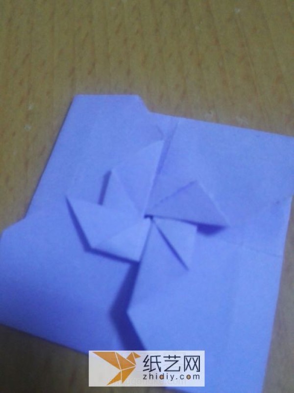 An envelope with an origami windmill pattern and a Teacher’s Day greeting card inside.