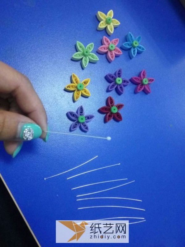 Beautiful quilled paper bouquet and small potted plant as Teachers Day gift