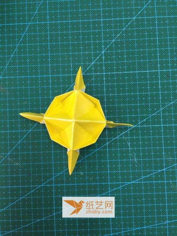 A step-by-step tutorial on how to make origami holiday lanterns