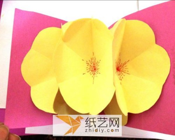 Illustrated tutorial on making handmade greeting cards with three-dimensional paper flowers using the exploding box mechanism