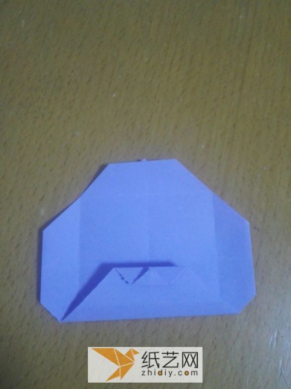 An envelope with an origami windmill pattern and a Teacher’s Day greeting card inside.