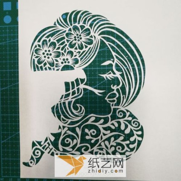 The production of paper-cut female profile, traditional folk handmade production