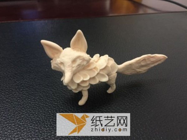 Cute little fox made of ultra-light clay