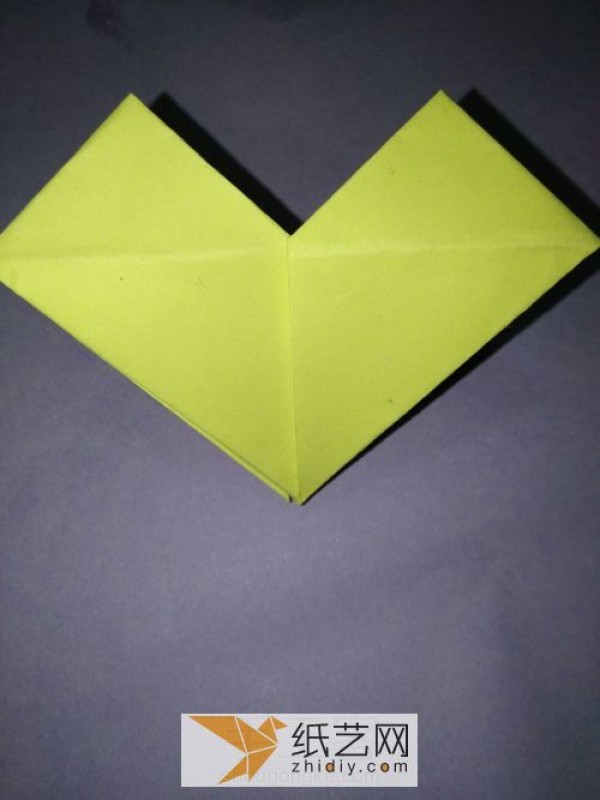 This origami heart shape can be used as a gift for Chinese Valentines Day. Here are the step-by-step pictures.