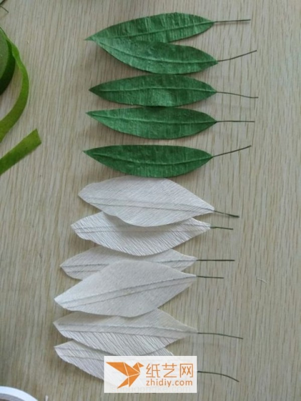 Tutorial illustration of paper art lily New Year decoration made from crepe paper