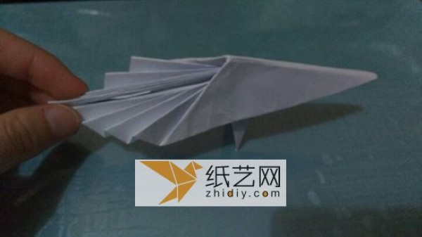 An origami peacock with its tail open