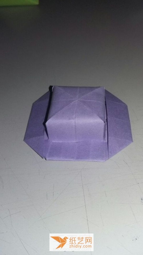 A tutorial on how to make a simple origami hat. I wouldn’t object if it’s an origami box.