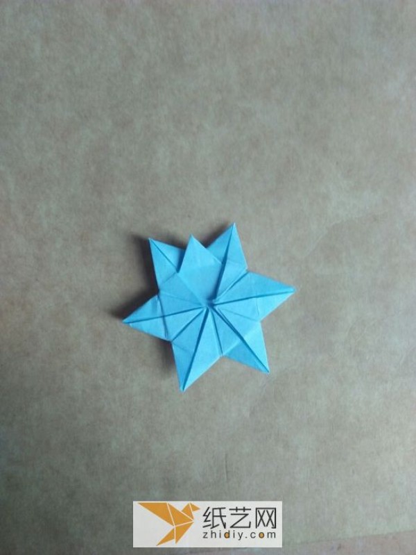 You can also fold a piece of paper into three-dimensional snowflakes!