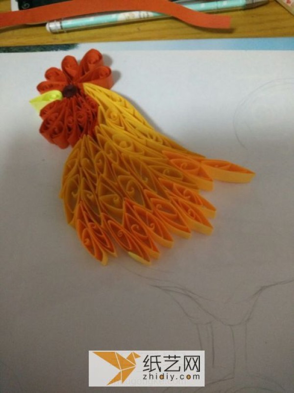 Illustration of the paper drawing tutorial of a big rooster made with quill paper. A New Year’s gift for the Year of the Rooster.