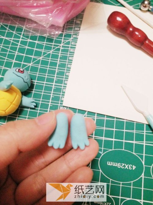 Illustrated tutorial on making DIY Pokemon Squirtle from clay. Cartoon dolls made of clay.