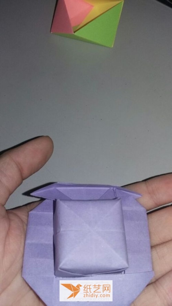 A tutorial on how to make a simple origami hat. I wouldn’t object if it’s an origami box.