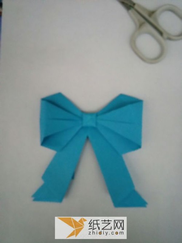 Perfectly shaped origami bow, a must-have decoration on various greeting cards