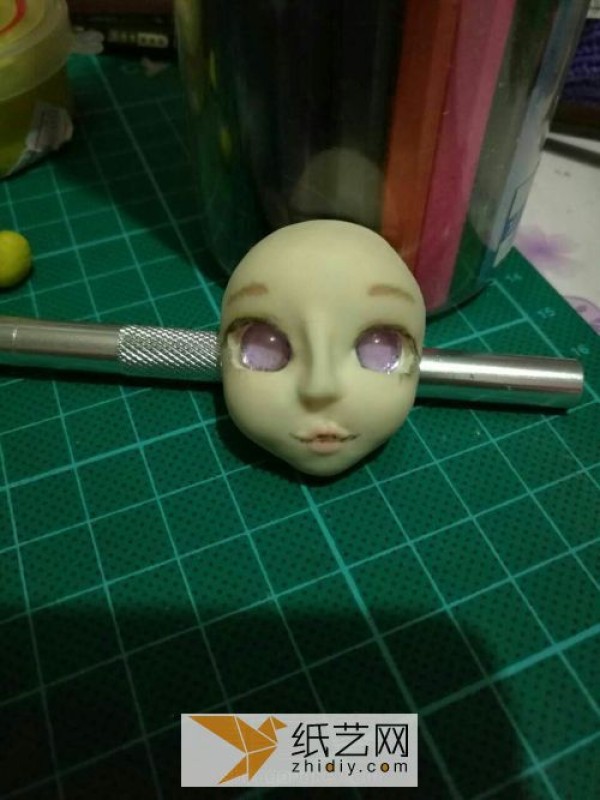 Use ultra-light clay to create fake eyes for dolls