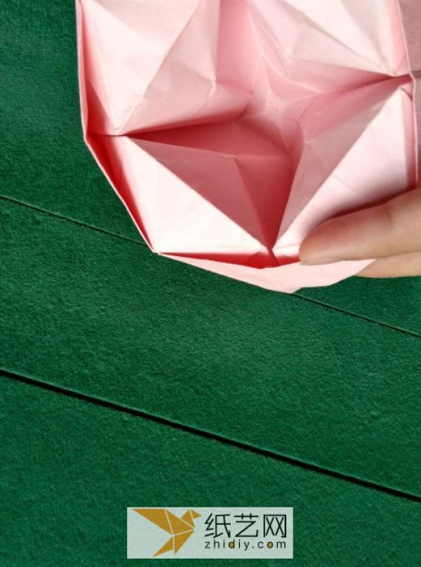 The wine glass origami rose transforms into a beautiful origami basket in just a few steps