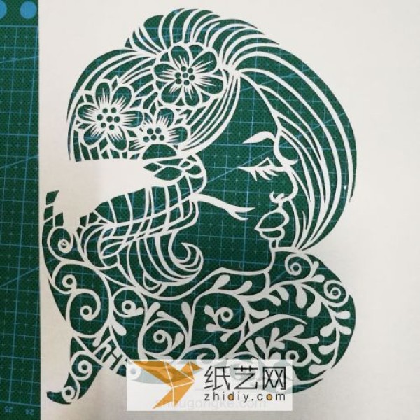 The production of paper-cut female profile, traditional folk handmade production