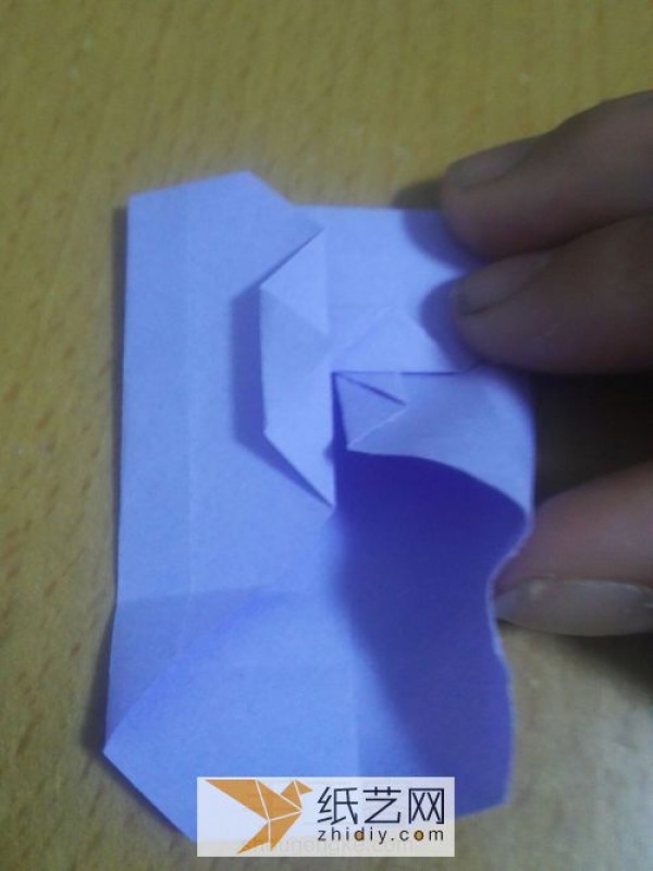 An envelope with an origami windmill pattern and a Teacher’s Day greeting card inside.